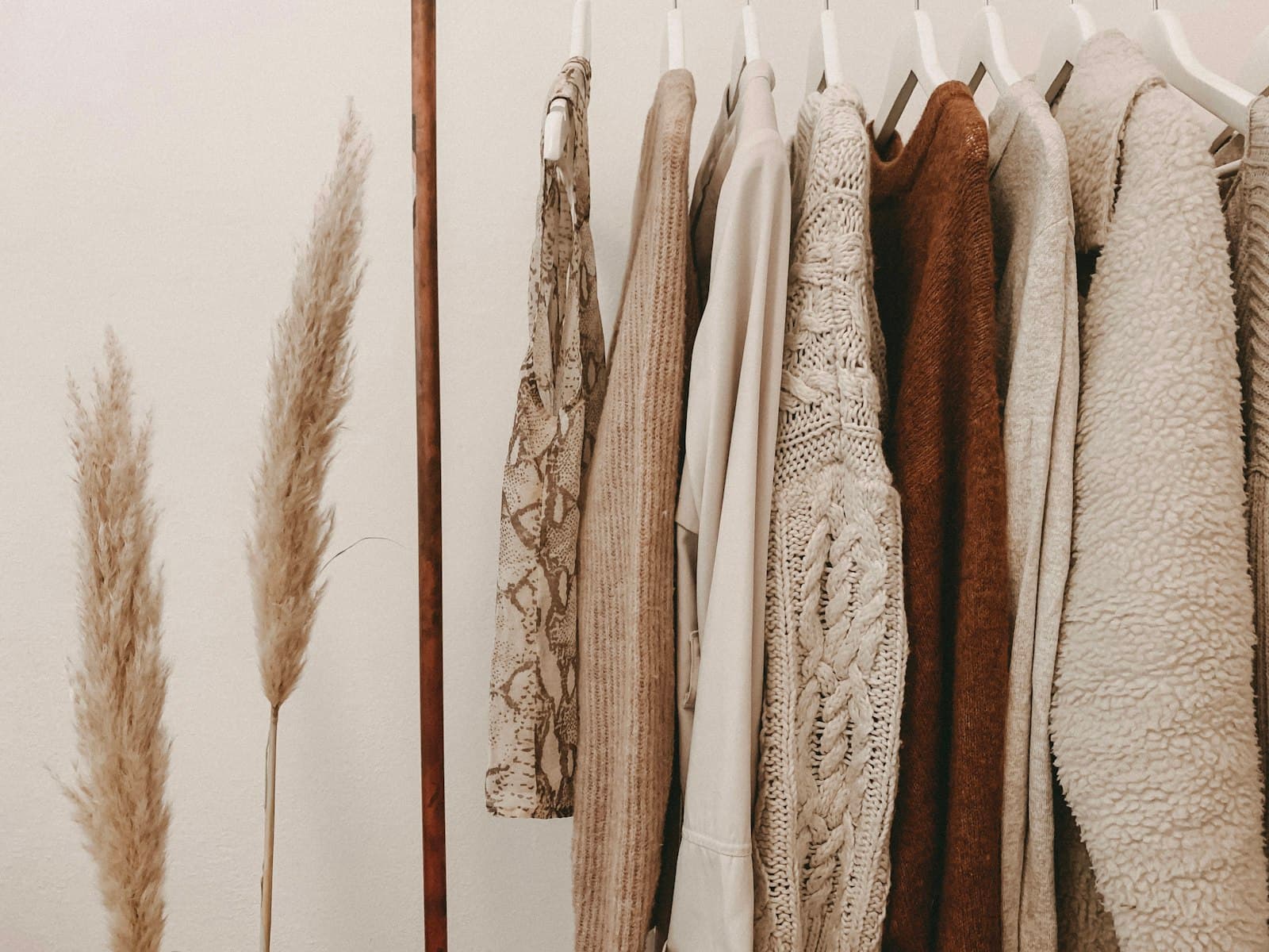 Clothing rack with neutral-toned garments